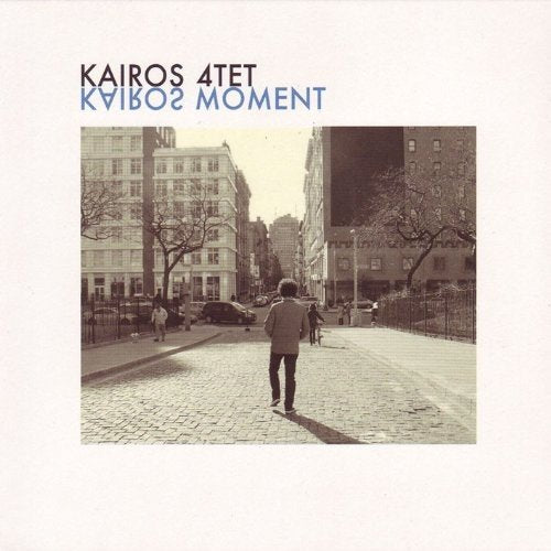 Album cover with sepia-toned city street scene, person walking away, on a white background.