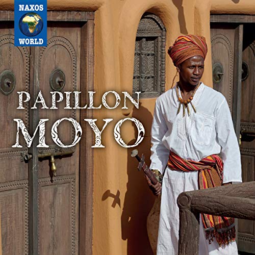 "Album cover featuring a man in traditional attire standing by an ornate wooden door."