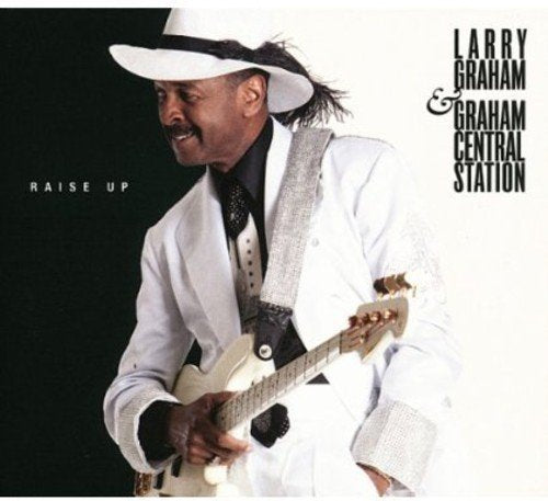 Album cover featuring a man in white suit playing a white electric guitar.