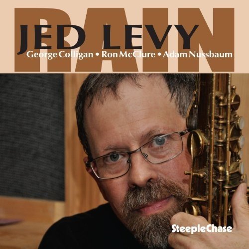 "Album cover featuring a man holding a saxophone, with text 'Jed Levy' and 'Rain'."