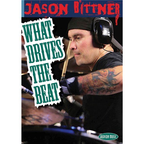 "Drummer Jason Bittner in headphones, playing drums with visible tattoos on his arm."
