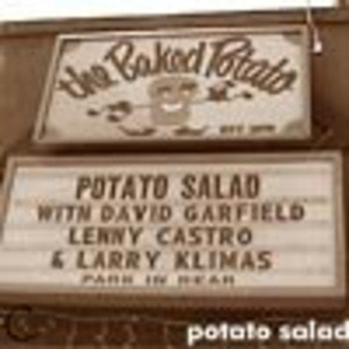 A blurry image of a marquee sign displaying "Potato Salad" and guest names.