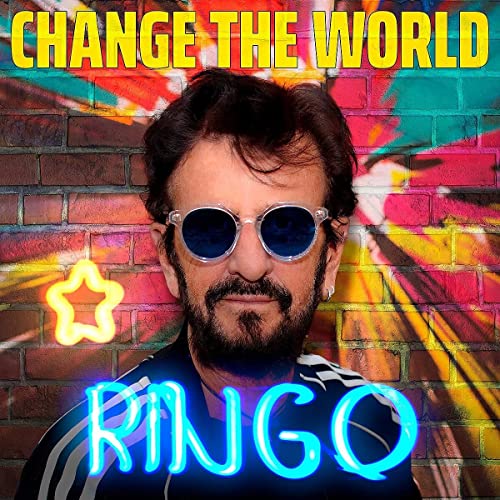 Ringo Starr portrait with colorful brick wall and neon lighting.