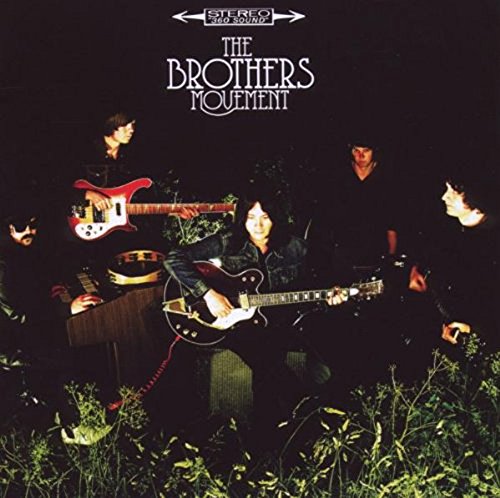 "Album cover with four musicians playing instruments surrounded by greenery at night."