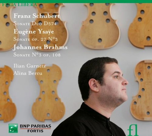 CD cover with man in black shirt and violin back plates in background.