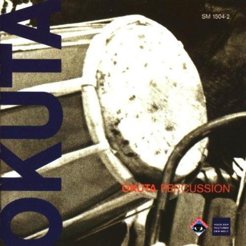 A CD cover featuring a close-up of a drum with dark blue and red text.