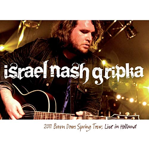 "Album cover featuring Israel Nash Gripka playing guitar on stage with stage lights."