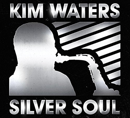 "Album cover with silhouette of man blowing silver trumpet, against black and silver background."