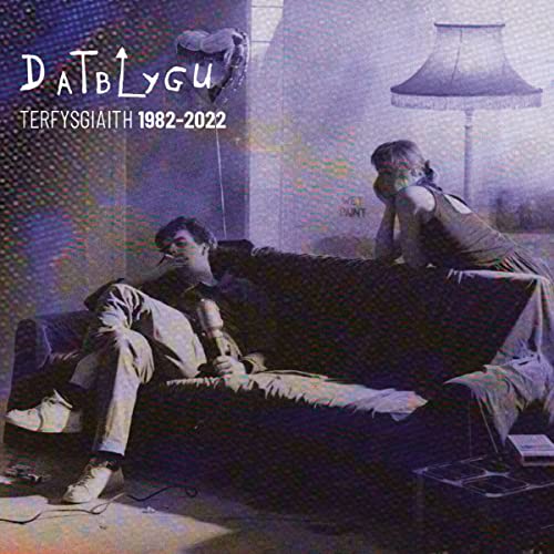 CD cover: two figures in a room with a lamp, distorted imagery.