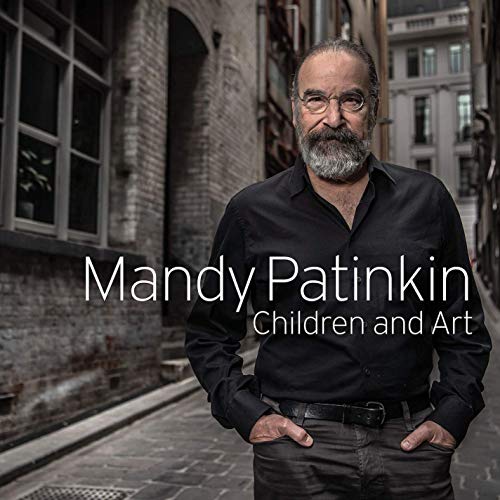 "Mandy Patinkin album cover: man with gray beard in black shirt on cobblestone street."