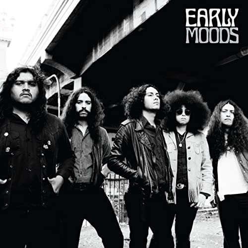 Black and white photo of five people with long hair, album cover.