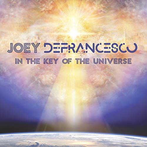 "Album cover with 'Joey Defrancesco - In The Key Of The Universe' text, earth, and sun."