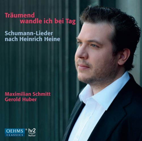 Man in black suit and white shirt on a CD cover.