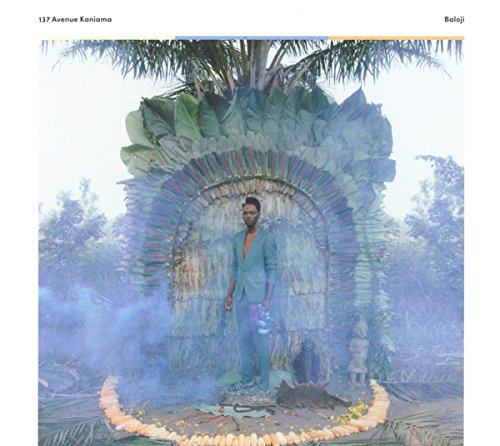 Album cover with a man standing in front of an archway surrounded by foliage.