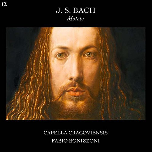 "CD cover with a portrait of a man with long, wavy hair on a black background."