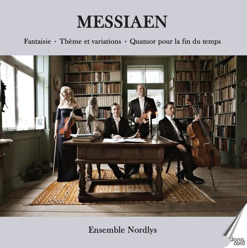 Musicians with violin, cello, and clarinet in a room with bookshelves.