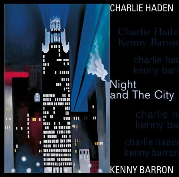 Dark blue album cover depicting a stylized nighttime city skyline.