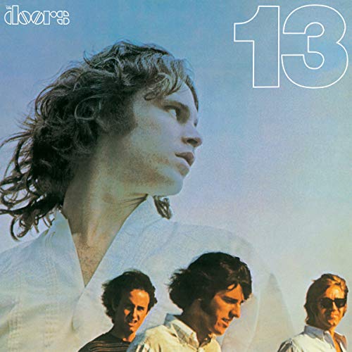 The Doors album cover featuring Jim Morrison and three band members against a blue sky.