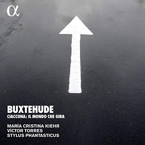 A CD cover featuring a white arrow on a dark, wet asphalt background.
