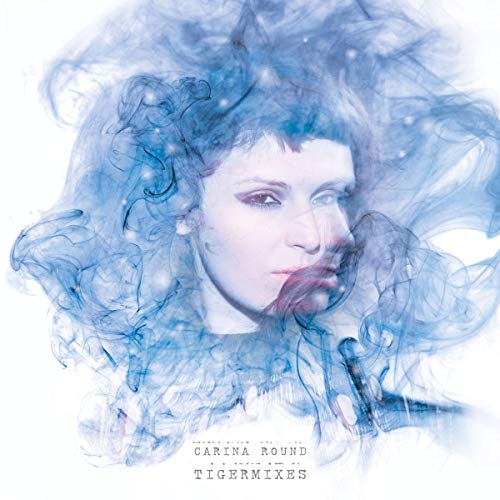 CD cover: woman’s face emerging from swirling blue smoke and texture.
