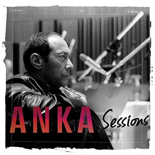 Black and white portrait of Paul Anka in a recording studio, album cover.