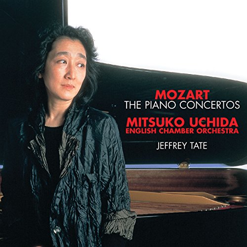 Mitsuko Uchida beside a grand piano on a Mozart piano concertos CD cover.