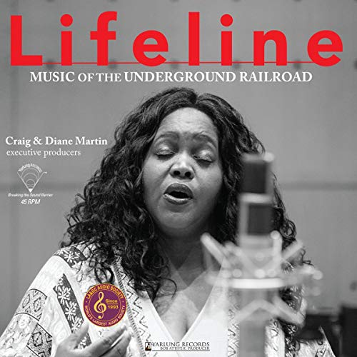 Vinyl album cover featuring a Black woman singing into a microphone.