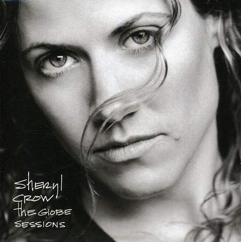 Black and white CD cover featuring a close-up portrait of Sheryl Crow.