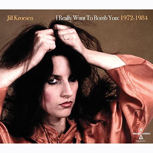 Jill Kroesen album cover: woman with dark hair, looking intently forward.