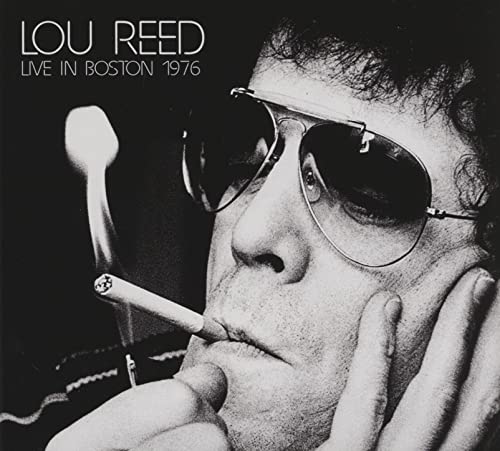 Black and white portrait of Lou Reed with sunglasses and a cigarette.