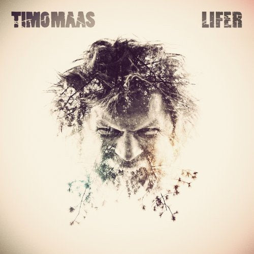 Album cover with a man's face and messy hair, surrounded by debris.