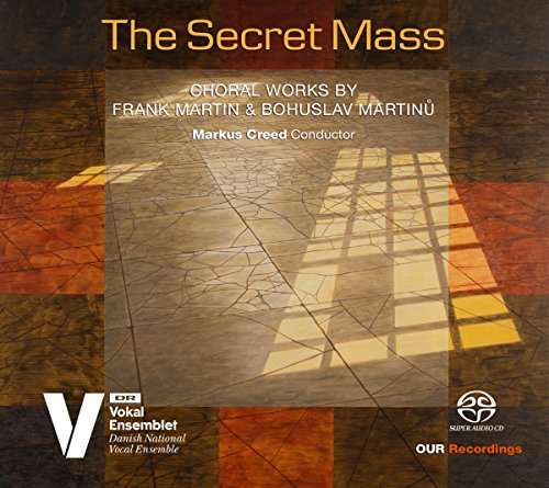 The image is a CD cover with a stained glass window design and text. Alt text: CD cover with stained glass window and text "The Secret Mass".