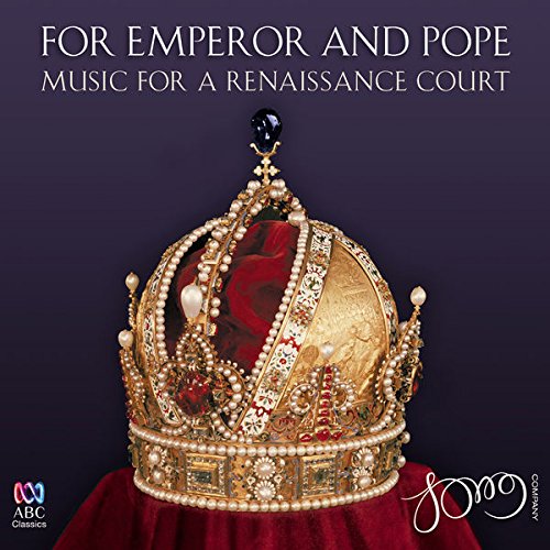 A jewelled crown on a red velvet surface, against a dark purple background.