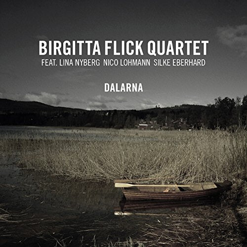 "CD cover featuring a black and white photo of a wooden boat in a marshy lake."