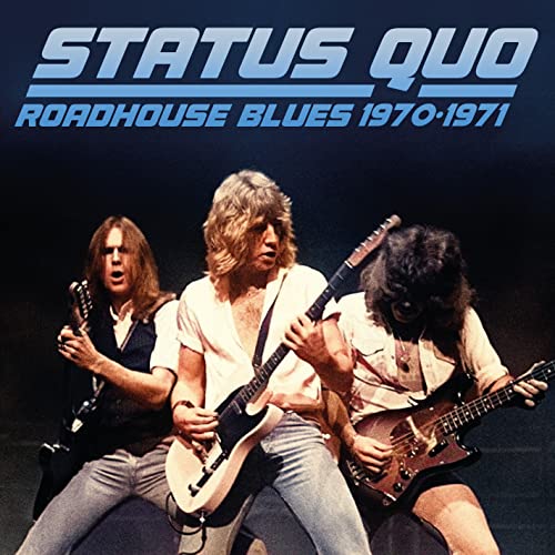 Status Quo album cover featuring three musicians with guitars.