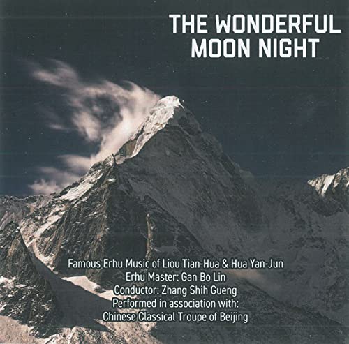CD cover: snowy mountains under a night sky with album title.