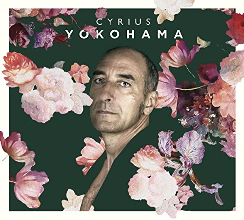 CD cover: man’s portrait surrounded by watercolor-style pink and red flowers.