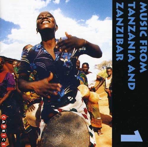 CD cover: woman playing a drum with others in Tanzania and Zanzibar.