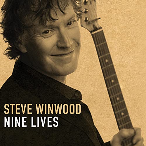 "Album cover featuring Steve Winwood holding a guitar, sepia-toned with text."