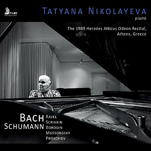 "Black and white CD cover featuring a pianist playing a grand piano."