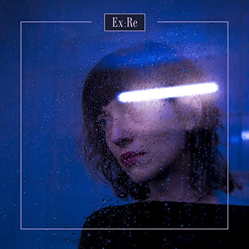 CD cover: woman’s face partially obscured by rain and a bright light.
