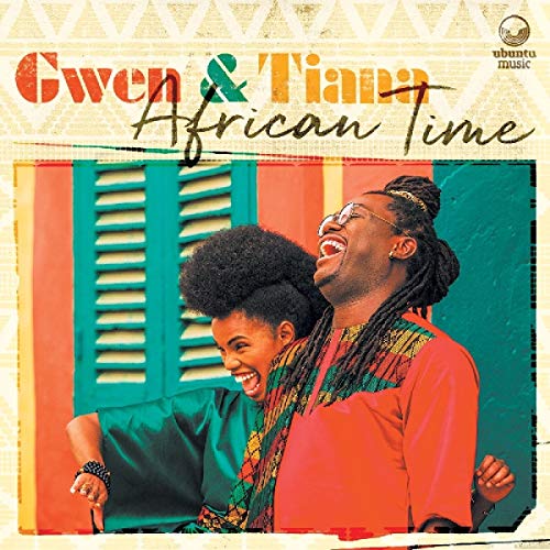 "Album cover featuring two smiling women in colorful clothing against a vibrant background."