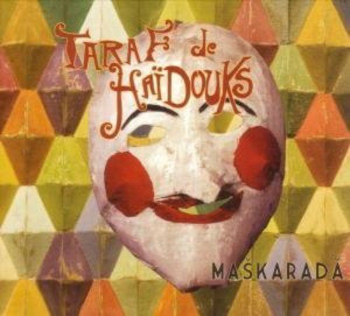 "Album cover featuring a white mask with red cheeks on a geometric background."