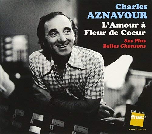 Charles Aznavour's album cover with a black-and-white photo and French text overlay.