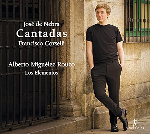 CD cover featuring a man in black leaning against a gate.