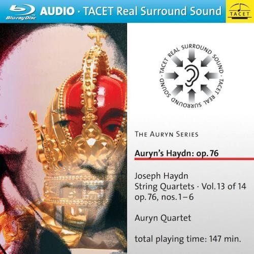 The image is a Blu-ray disc cover featuring a gold mask and text. The alt text is: "Blu-ray disc cover with gold mask and text describing Haydn string quartets."