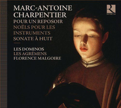 CD cover with a portrait of a boy holding a musical instrument.