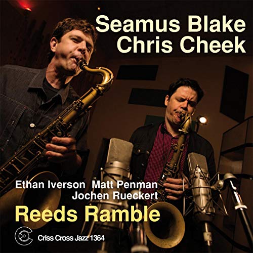 Two musicians playing saxophones in a recording studio, album cover.