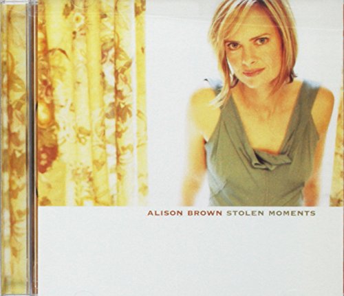 CD case cover with a blonde woman and yellow floral pattern.