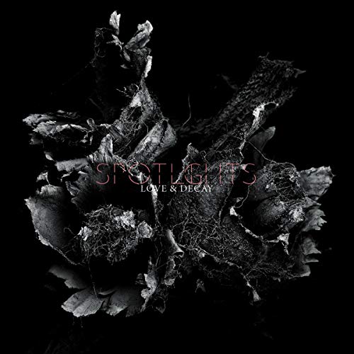 Black and white image of decaying flowers against a black background with superimposed text.